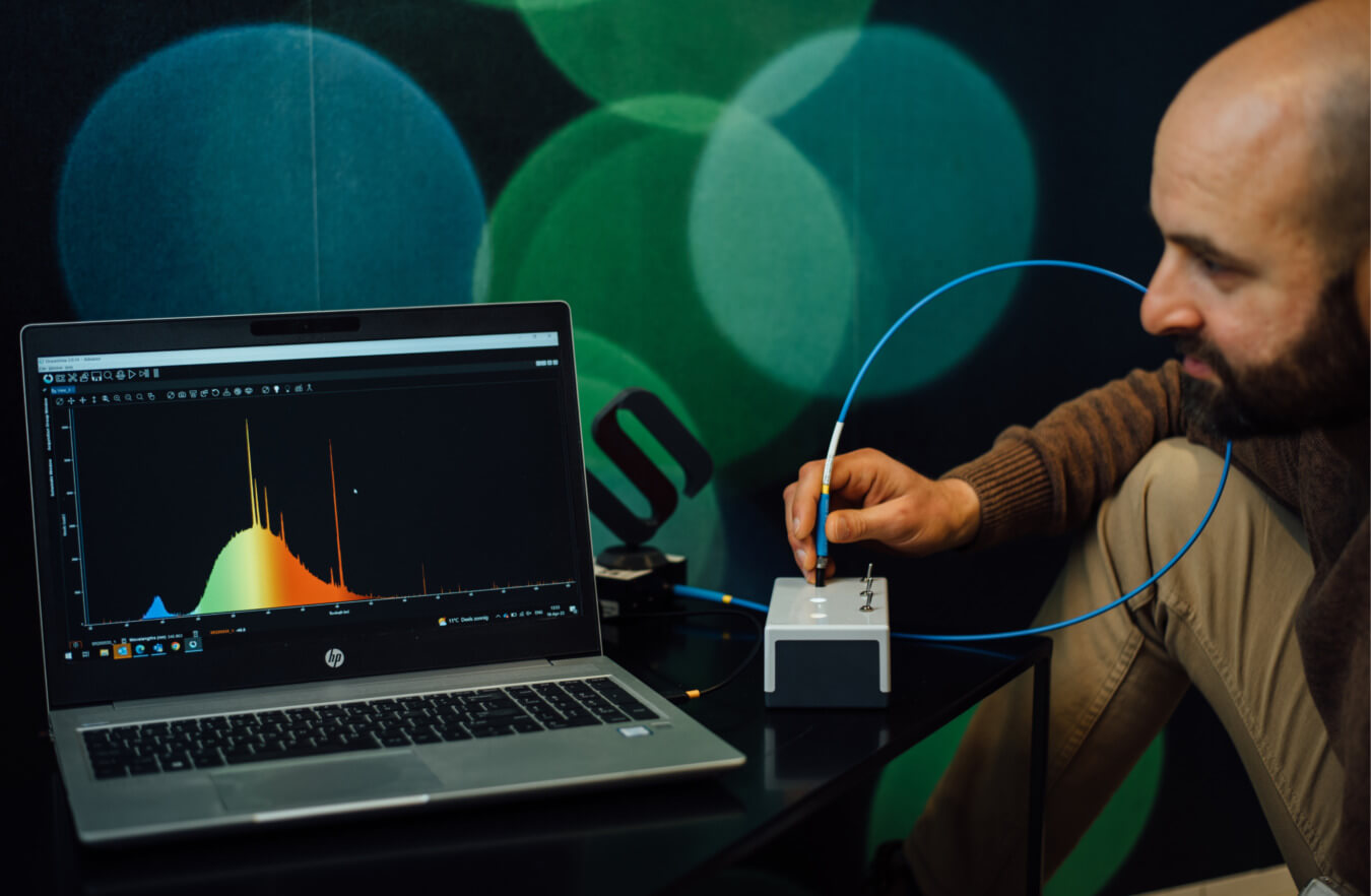 A scientist looking at the light spectrum